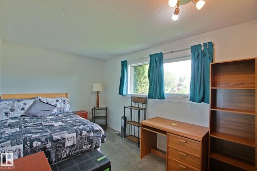 Interior room featuring light-colored walls and a textured ceiling - 3536 104 Street Nw, Edmonton, AB - Indoor Photo Showing Bedroom