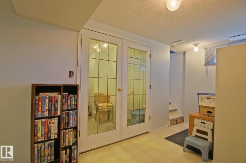 Double French doors with grid-patterned glass panels - 3536 104 Street Nw, Edmonton, AB - Indoor