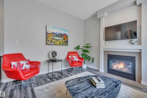#29 4821 Terwillegar Cm Nw, Edmonton, AB - Indoor Photo Showing Living Room With Fireplace