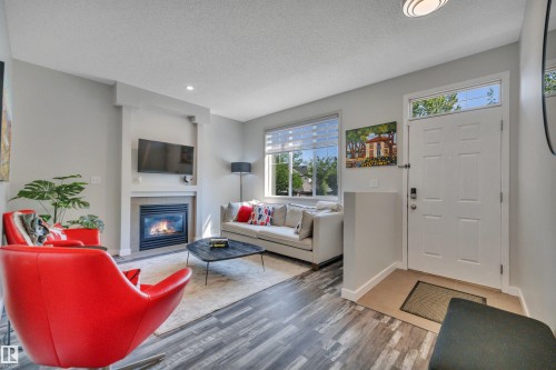 #29 4821 Terwillegar Cm Nw, Edmonton, AB - Indoor Photo Showing Living Room With Fireplace