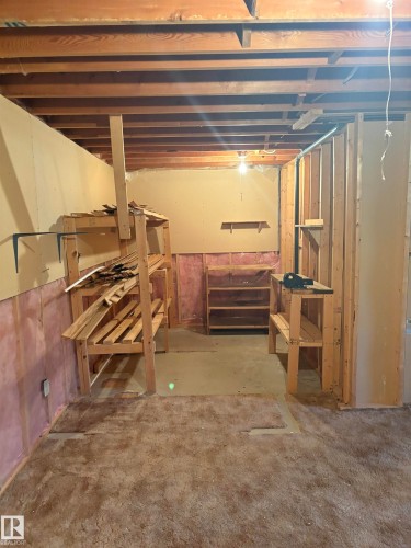 Unfinished basement space featuring exposed wood joists and structural framing - 17520 Callingwood Road Nw, Edmonton, AB - Indoor