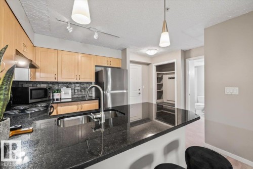 #115 11453 Ellerslie Rd Sw, Edmonton, AB - Indoor Photo Showing Kitchen With Double Sink