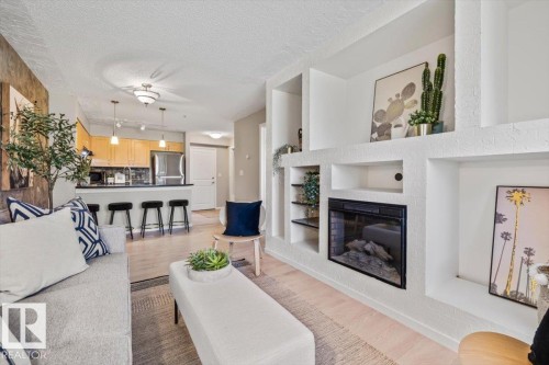 #115 11453 Ellerslie Rd Sw, Edmonton, AB - Indoor Photo Showing Living Room With Fireplace