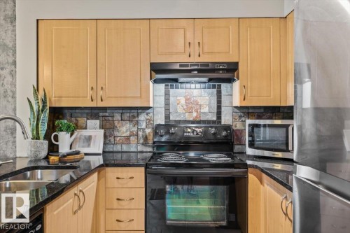 #115 11453 Ellerslie Rd Sw, Edmonton, AB - Indoor Photo Showing Kitchen With Double Sink