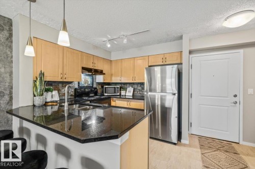 #115 11453 Ellerslie Rd Sw, Edmonton, AB - Indoor Photo Showing Kitchen With Double Sink