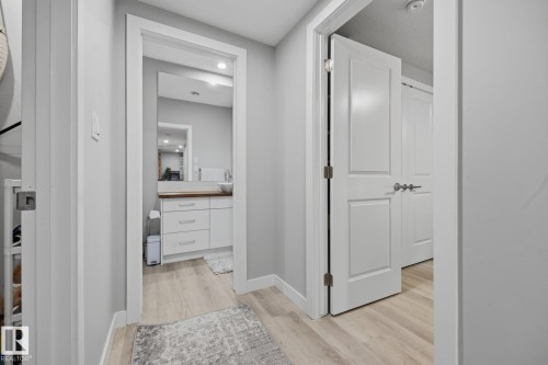 Hallway with light wood-finish flooring - 3870 Robins Crescent Nw, Edmonton, AB - Indoor Photo Showing Other Room