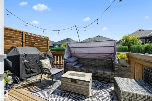 Spacious outdoor deck featuring natural wood flooring and horizontal slat privacy fencing - 3870 Robins Crescent Nw, Edmonton, AB - Outdoor With Deck Patio Veranda With Exterior