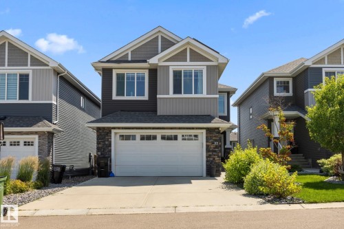 Two-story residence featuring a two-car garage with transom windows - 3870 Robins Crescent Nw, Edmonton, AB - Outdoor With Facade