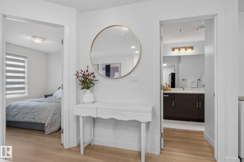 Wood-finish flooring throughout - #203 5521 7 Av Sw, Edmonton, AB - Indoor Photo Showing Bedroom