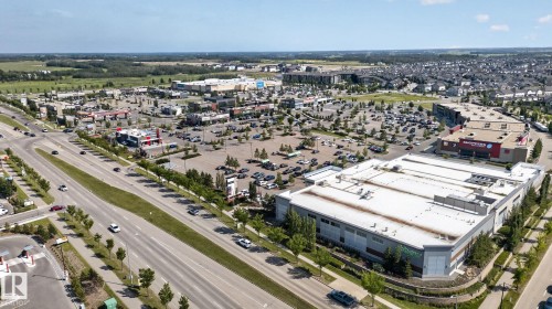 Aerial perspective showcasing commercial developments and residential areas - #203 5521 7 Av Sw, Edmonton, AB - Outdoor With View