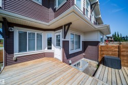 Exterior deck with wood planking and a partial privacy fence - 