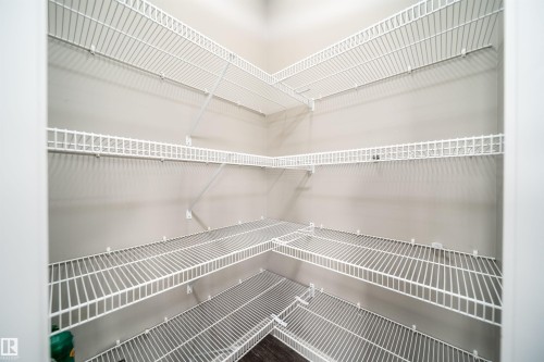 Corner pantry featuring white wire shelving - 114 James Crescent, St. Albert, AB - Indoor With Storage