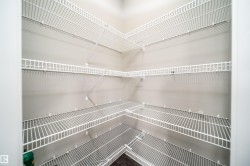 Corner pantry featuring white wire shelving - 
