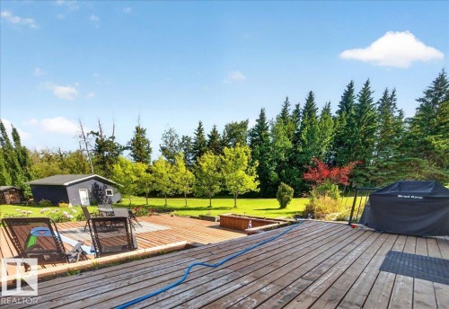 Expansive wood deck with multiple seating areas - #47 21061 Wye Rd, Rural Strathcona County, AB - Outdoor With Deck Patio Veranda