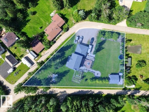 Expansive property featuring a residence with a gray roof, a broad green lawn, and mature perimeter trees - #47 21061 Wye Rd, Rural Strathcona County, AB - Outdoor With View