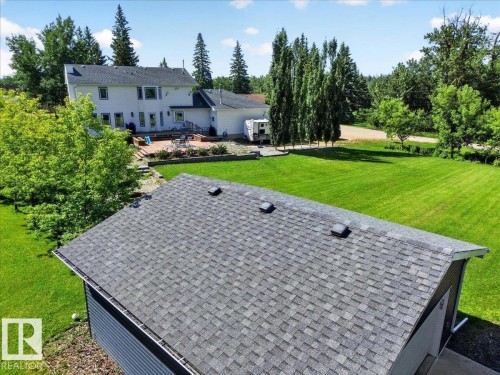 Detached garage with asphalt shingle roofing and siding - #47 21061 Wye Rd, Rural Strathcona County, AB - Outdoor With Deck Patio Veranda