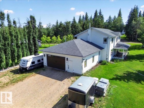 Two-story residential structure with white siding and a covered porch - #47 21061 Wye Rd, Rural Strathcona County, AB - Outdoor