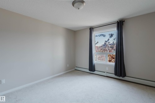 Light-toned carpeted flooring complements neutral wall paint - #7306 7327 South Terwillegar Dr Nw, Edmonton, AB - Indoor Photo Showing Other Room