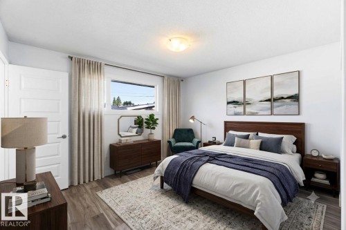 Bedroom featuring wood-finish flooring, white walls, and a window with natural light - 13524 62 Street Nw, Edmonton, AB - Indoor Photo Showing Bedroom