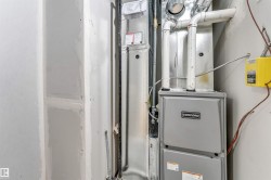 Concord furnace unit with visible ductwork and associated piping - 