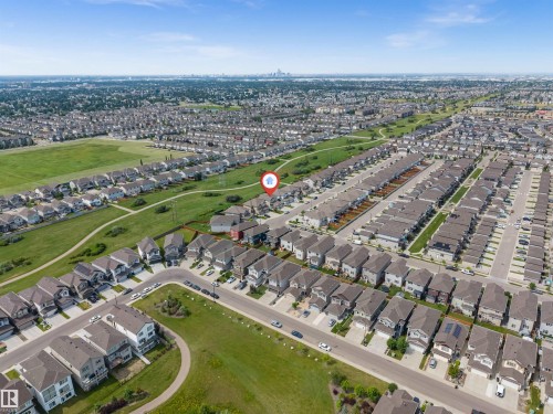 Aerial perspective of a residential neighborhood featuring numerous detached and attached homes - 1712 27 St Nw, Edmonton, AB - Outdoor With View