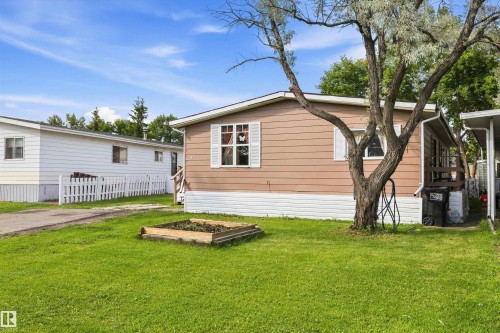 Brown horizontal siding with white trim and shutters - 46 Maple Terrace Northwest, Edmonton, AB - Outdoor