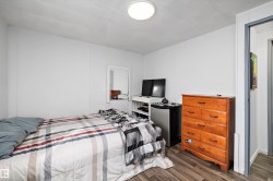 Neutral wall finishes with a ceiling-mounted light fixture - 