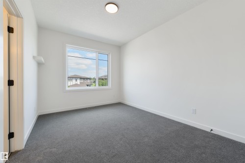 23 Lakevista, Beaumont, AB - Indoor Photo Showing Other Room