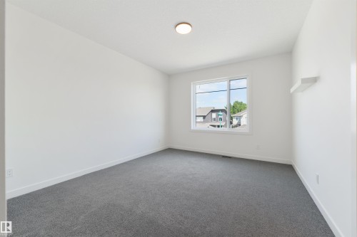 23 Lakevista, Beaumont, AB - Indoor Photo Showing Other Room