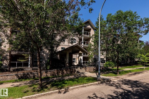 Multi-story residential building with a covered main entrance - #103 12838 65 St Nw Nw, Edmonton, AB - Outdoor