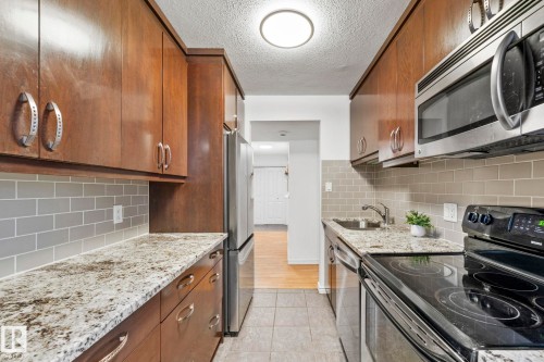 #105 11011 86 Av Nw, Edmonton, AB - Indoor Photo Showing Kitchen With Upgraded Kitchen