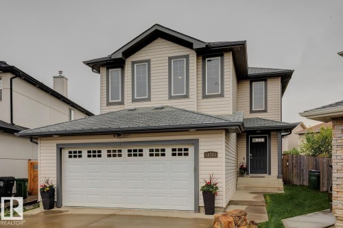 Contemporary two-story residence featuring light-colored siding and dark trim - 16765 119 Street Nw, Edmonton, AB - Outdoor
