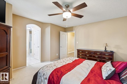 Carpeted room with a ceiling fan light fixture - 16765 119 Street Nw, Edmonton, AB - Indoor Photo Showing Bedroom