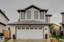 Contemporary two-story residence with light-colored siding and dark trim - 16765 119 Street Nw, Edmonton, AB  - Outdoor 