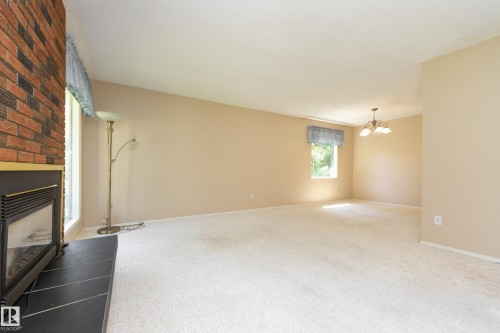 84 Larose Drive, St. Albert, AB - Indoor Photo Showing Other Room With Fireplace