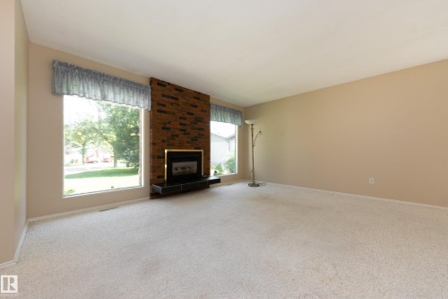 84 Larose Drive, St. Albert, AB - Indoor Photo Showing Living Room With Fireplace