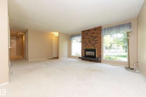 84 Larose Drive, St. Albert, AB - Indoor Photo Showing Living Room With Fireplace