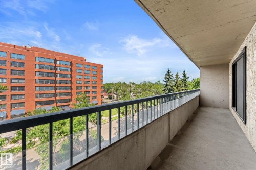 Balcony with concrete flooring and a metal and glass railing - #503 10175 114 St Nw, Edmonton, AB - Outdoor With Balcony With Exterior