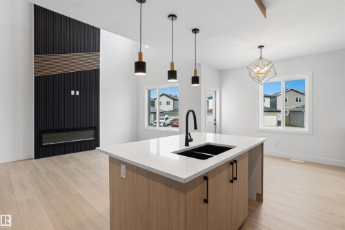 409 Munn Court, Leduc, AB - Indoor Photo Showing Kitchen With Double Sink