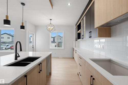 409 Munn Court, Leduc, AB - Indoor Photo Showing Kitchen With Double Sink
