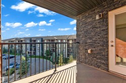 Private balcony featuring a concrete floor and black metal railings - 