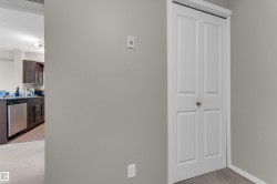 White bi-fold door with satin nickel hardware - 