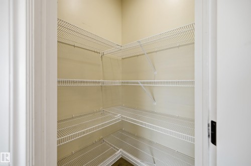 Spacious closet featuring white wire shelving system - 1 Southfork Close, Leduc, AB - Indoor With Storage