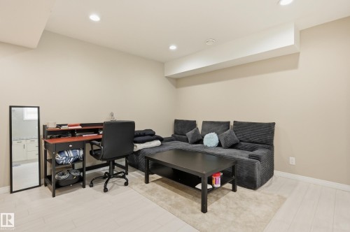Recessed lighting illuminates this versatile space featuring light wood-finish flooring and neutral wall tones - 1 Southfork Close, Leduc, AB - Indoor
