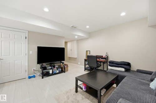 Recessed lighting illuminates this bright space featuring light wood-finish flooring and neutral wall tones - 1 Southfork Close, Leduc, AB - Indoor