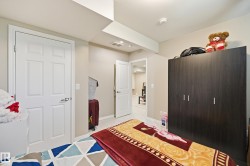 Room featuring light-colored walls and wood-finish flooring - 