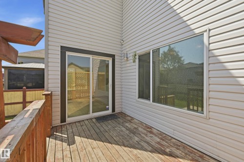 Wood-finish decking with railings and a partial pergola structure - 1 Southfork Close, Leduc, AB - Outdoor With Deck Patio Veranda With Exterior