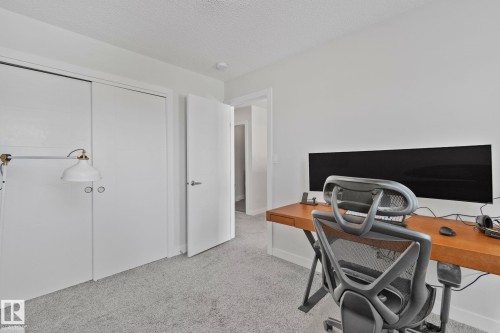 Neutral-toned room featuring a light grey carpet, white walls, and a textured ceiling - 249 39A Avenue, Edmonton, AB - Indoor Photo Showing Office