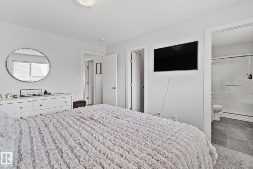 Bedroom featuring neutral wall paint, recessed lighting, and a window with blinds - 249 39A Avenue, Edmonton, AB - Indoor Photo Showing Bedroom