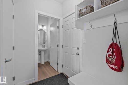 Built-in mudroom bench with shelving and coat hooks - 249 39A Avenue, Edmonton, AB - Indoor Photo Showing Other Room